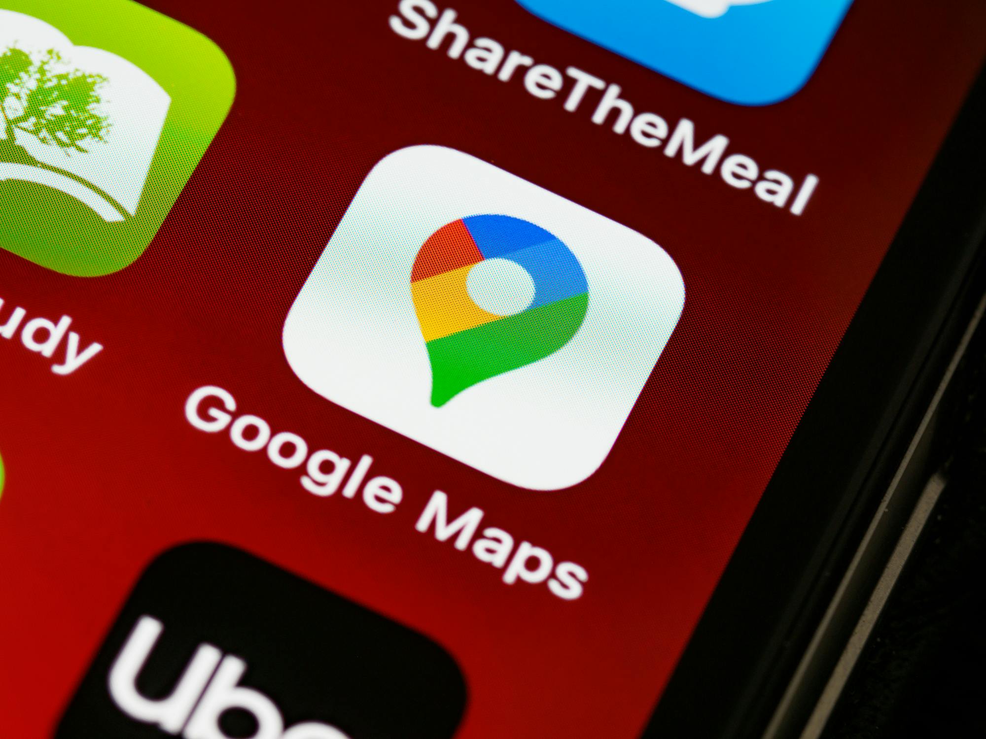 Google Maps app on smartphone showing local business search results